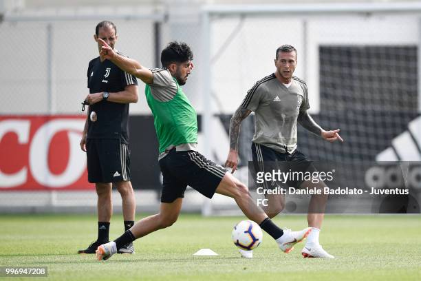 Emre Can and Federico Bernardeschi during a Juventus training session at Juventus Training Center on July 12, 2018 in Turin, Italy.