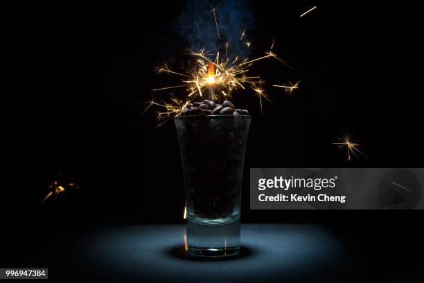extra strong coffee - glass vase black background foto e immagini stock