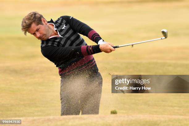Robert Rock of England plays out of the rough on hole eighteen during day one of the Aberdeen Standard Investments Scottish Open at Gullane Golf...