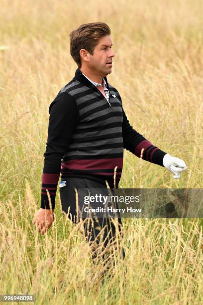 Robert Rock of England walks through the rough on hole eighteen during day one of the Aberdeen Standard Investments Scottish Open at Gullane Golf...