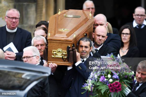 Mourners carry the coffin during the funeral of Bay City Roller guitarist Alan Longmuir at Allan Church on July 12, 2018 in Bannockburn, Scotland....