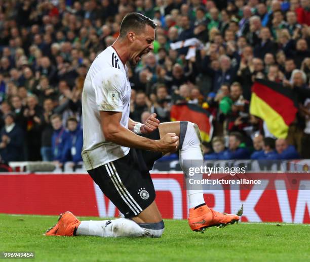 Germany's Sandro Wagner celebrates after scoring in the FIFA World Cup Group C qualification match between Northern Ireland and Germany at the...