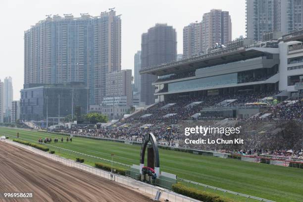 Jockeys compete the Race 4 Audemars Piguet Lady Millenary Handicap during the Audemars Piguet Queen Elizabeth II Cup race day at Sha Tin racecourse...