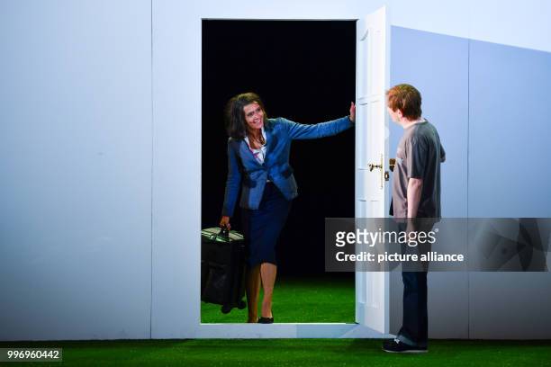Ulrike Folkerts as Cookie Close and Sven Prietz as Dan can be seen on stage during a photo rehearsal of the theatre piece "Fuer immer schoen" at the...