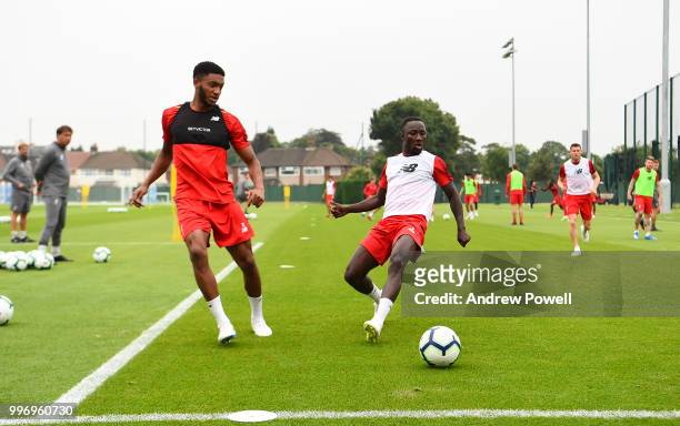 Joe Gomez and Naby Keita of Liverpool during a training session at Melwood Training Ground on July 12, 2018 in Liverpool, England.