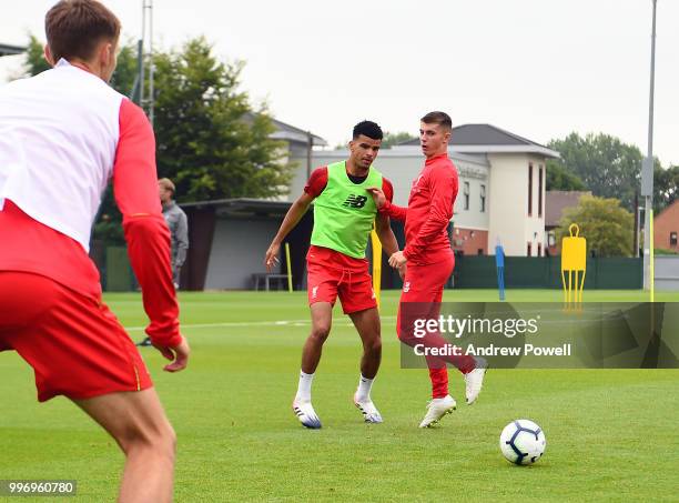 Dominic Solanke and Ben Woodburn of Liverpool during a training session at Melwood Training Ground on July 12, 2018 in Liverpool, England.