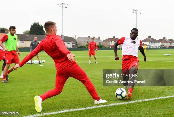 Ben Woodburn and Sheyi Ojo of Liverpool during a training session at Melwood Training Ground on July 12, 2018 in Liverpool, England.