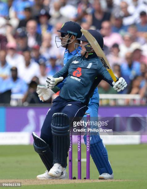 Jason Roy of England and MS Dhoni look on as Roy is caught during the 1st Royal London One-Day International between England and India on July 12,...
