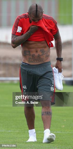 Arturo Vidal of FC Bayern Muenchen leaves the pitch after a training session at the club's Saebener Strasse training ground on July 12, 2018 in...