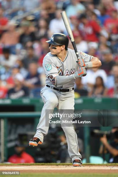 Derek Dietrich of the Miami Marlins prepares for a pitch during a baseball game against the Washington Nationals at Nationals Park on July 5, 2018 in...