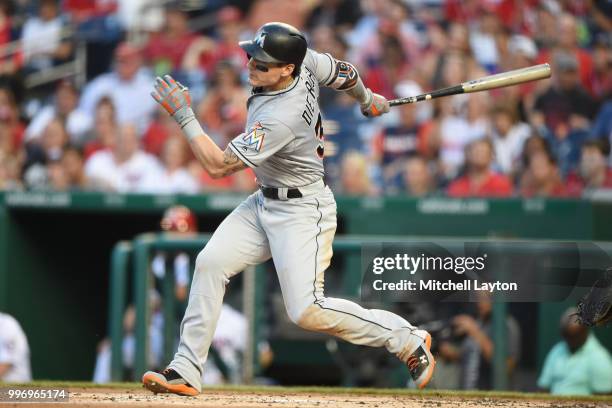 Derek Dietrich of the Miami Marlins prepares for a pitchtakes a swingshington Nationals at Nationals Park on July 5, 2018 in Washington, DC. The...
