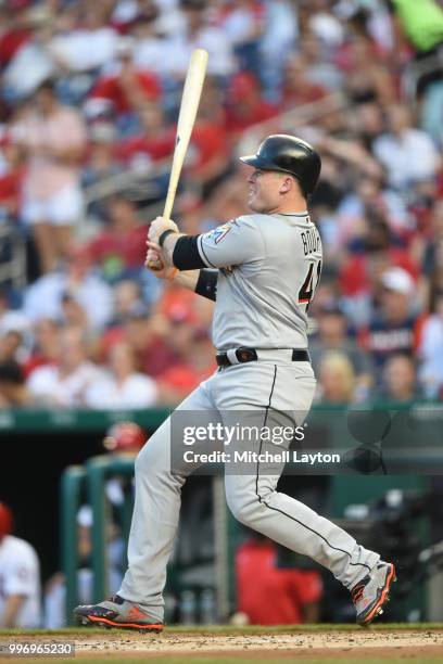 Justin Bour of the Miami Marlins takes a swing during a baseball game against the Washington Nationals at Nationals Park on July 5, 2018 in...