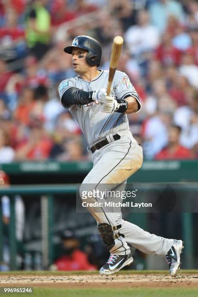 Martin Prado of the Miami Marlins takes a swing during a baseball game against the Washington Nationals at Nationals Park on July 5, 2018 in...