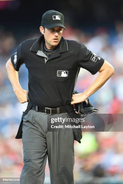 Umpire Mark Wagner looks on during a baseball game between the Washington Nationals and the Miami Marlins at Nationals Park on July 5, 2018 in...