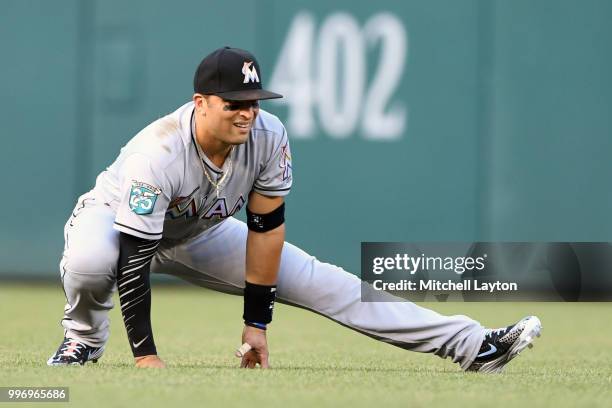 Martin Prado of the Miami Marlins warms up before a baseball game against the Washington Nationals at Nationals Park on July 5, 2018 in Washington,...