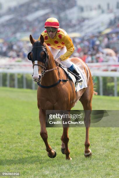 Jockey Olivier Peslier riding Gold-Fun during Race 7 The Sprint Cup at Sha Tin racecourse on April 26 , 2015 in Hong Kong.