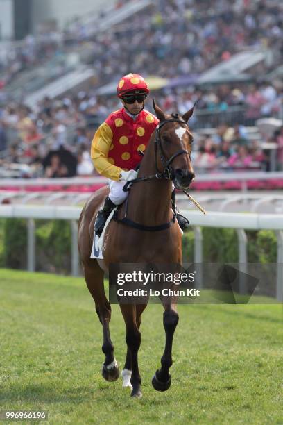 Jockey Joao Moreira riding Golden Harvest during Race 7 The Sprint Cup at Sha Tin racecourse on April 26 , 2015 in Hong Kong.