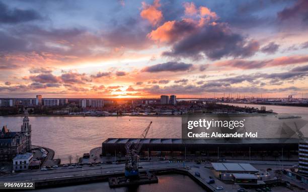 sunset over the port of antwerp - mol stock-fotos und bilder