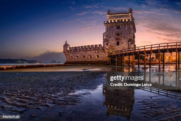 belem tower (tower of st vincent) at sunset. belem, lisbon, portugal. - domingo stock-fotos und bilder