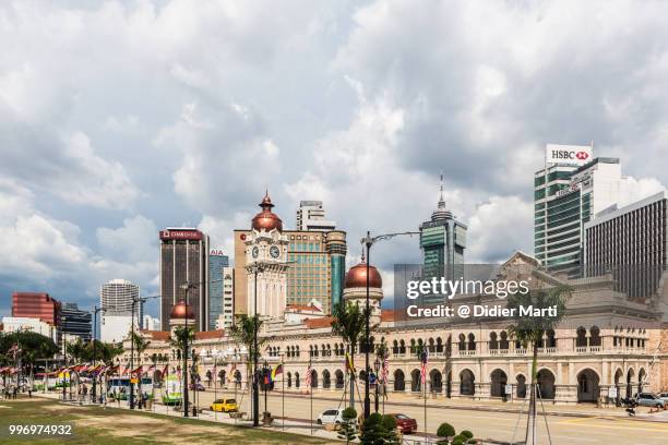 sultan abdul samad building by the independance square (merdeka) with the financial district in kuala lumpur, malaysia - didier marti stock pictures, royalty-free photos & images