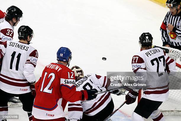 Referee and players watch the puck during the IIHF World Championship group F qualification round match between Czech Republic and Latvia at SAP...