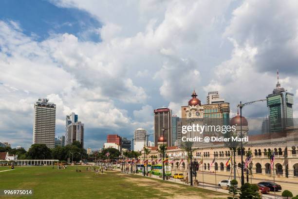 sultan abdul samad building by the independance square (merdeka) with the financial district in kuala lumpur, malaysia - didier marti stock pictures, royalty-free photos & images