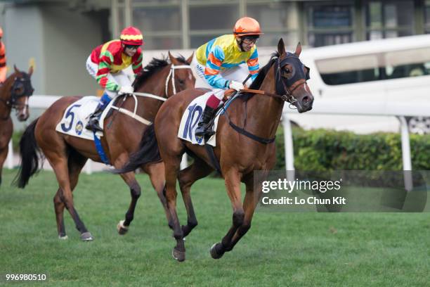 Jockey Olivier Doleuze riding Travel Renyi demoted to 2nd during Race 10 Audemars Piguet Lady Jules Audemars Handicap at Sha Tin racecourse on April...