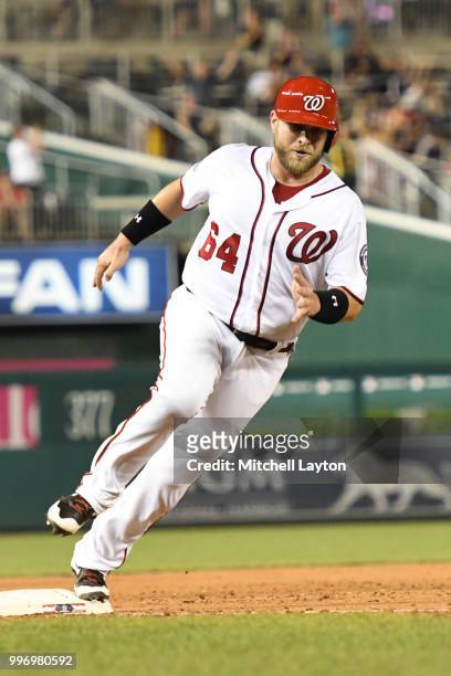Matt Adams of the Washington Nationals runs past third base to home plate during a baseball game against the Miami Marlins at Nationals Park on July...