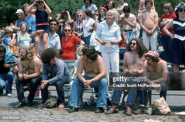 View of people, gathered in downtown Manhattan, during the bicentennial celebrations, New York, New York, July 4, 1976. They were there to watch a...