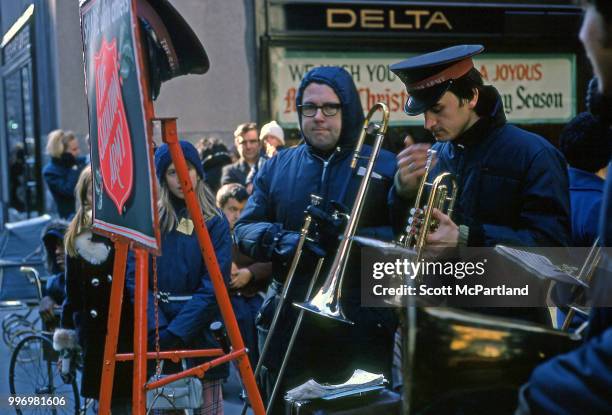 Members of a Salvation Army band as they perform, with brass instruments, for onlookers during the Christmas season at Rockefeller Center, New York,...