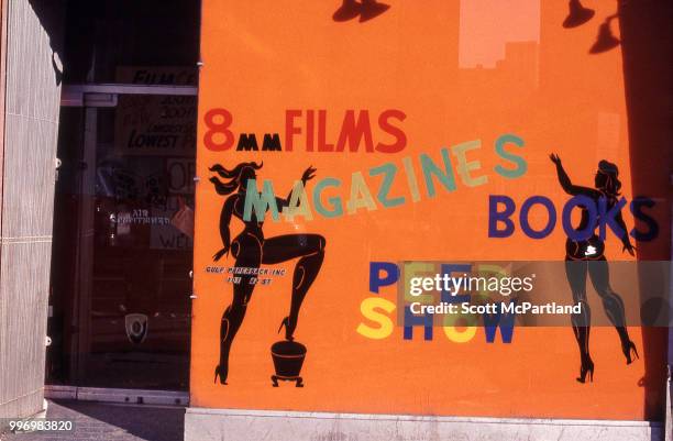 View of the store window and entrance of an unspecified sex shop on 42nd street in Manhattan's Times Square, New York, New York, March 1, 1970. The...