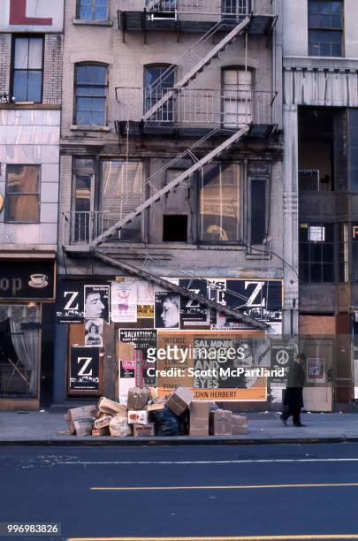 View of a boarded-up apartment building on Manhattan's Lower East Side, New York, New York, September 1, 1970. Cardboard boxes and trash is piled on...