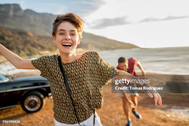 portrait of happy cheerful woman with boyfriend the coast at sunset - enjoy life exciting stock pictures, royalty-free photos & images