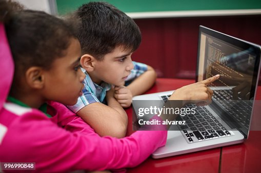 Students Creating Programs While Using Laptop High-Res Stock Photo ...