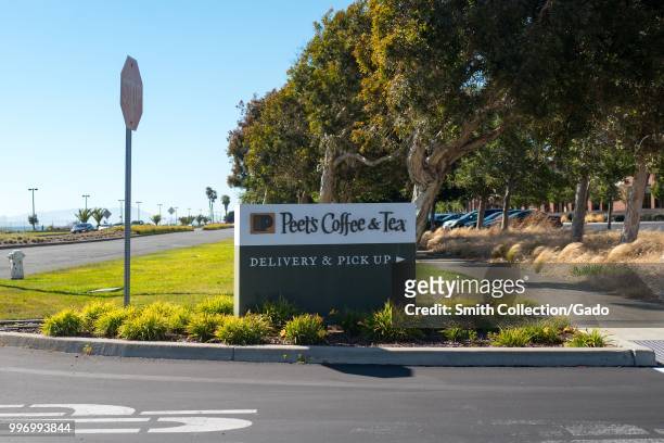Sign at entrance to main roasting plant for Peet's Coffee and Tea on Bay Farm Island, Alameda, California, July 9, 2018.