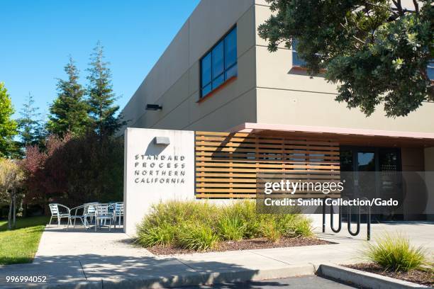 Sign with logo on facade of regional headquarters of herbal supplement company Standard Process of Northern California on Bay Farm Island, Alameda,...