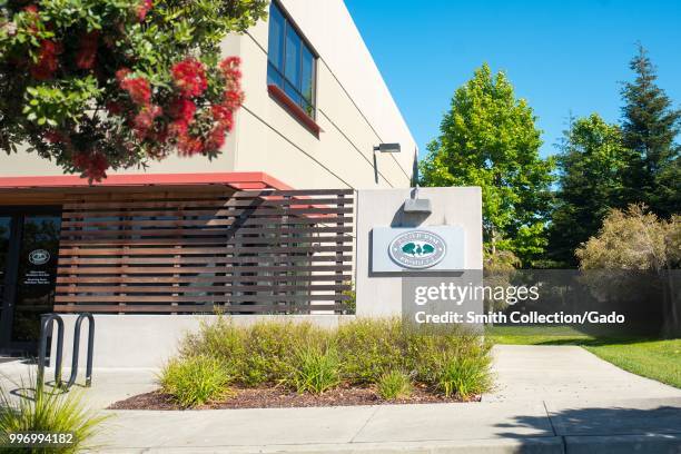 Sign with logo on facade at headquarters of Asian produce importer Pacific Rim Produce on Bay Farm Island, Alameda, California, July 9, 2018.