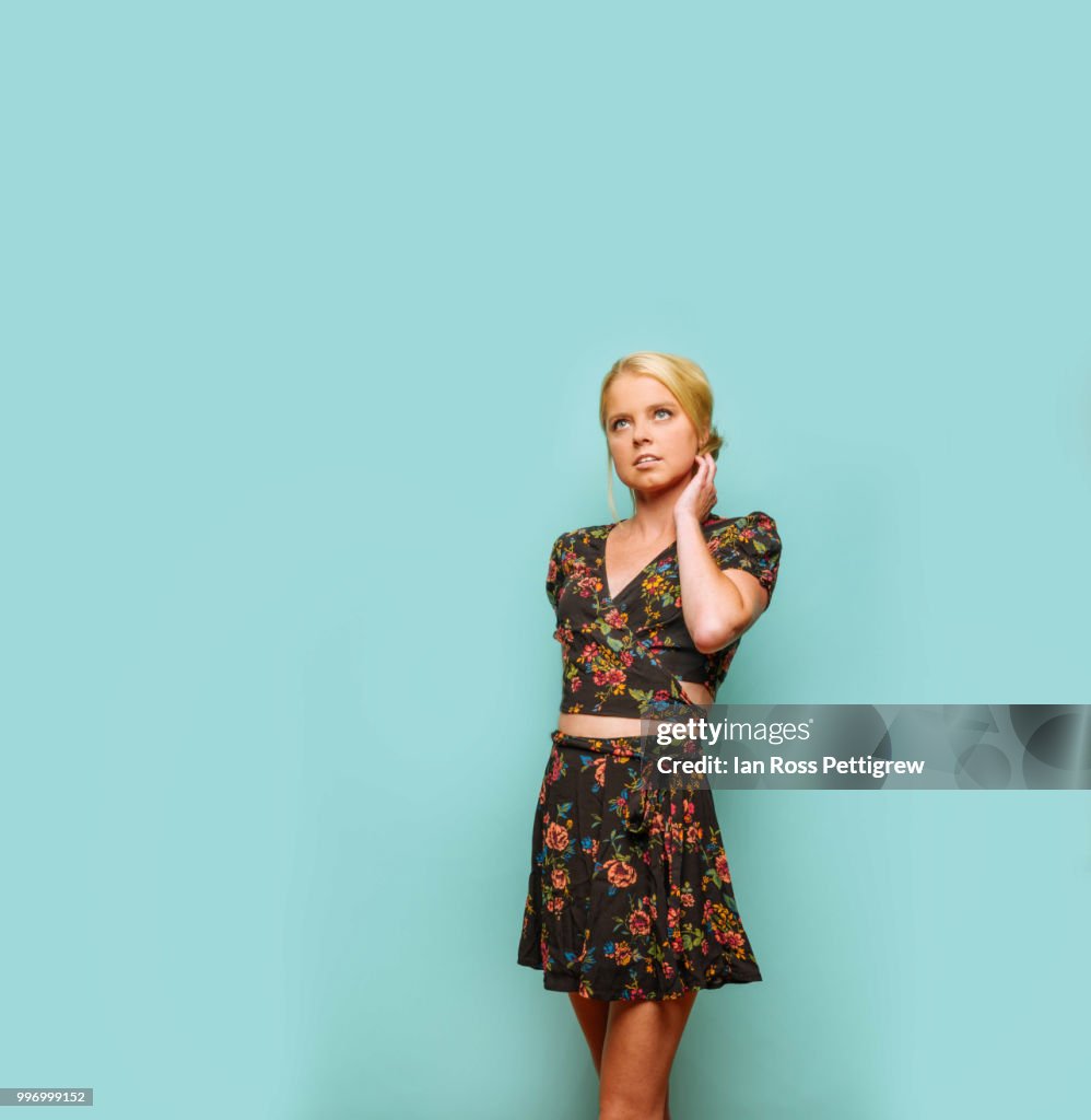 Beautiful young woman in floral summer dress