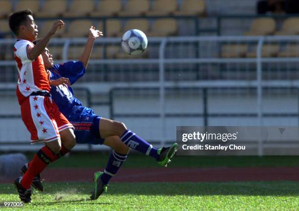 Phichitphonh Choeichiu of Thailand is challenged by Mohd Noh Alam Shah of Singapore during a Group A match between Thailand and Singapore held at the...