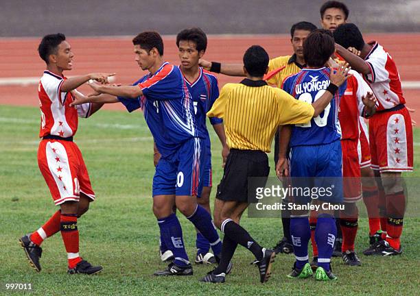 The Singapore and Thailand Players go at each other during a scuffle which leads to a sacking during a Group A match between Thailand and Singapore...