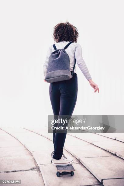 female riding skateboard on urban ramp - rolling stairs stock pictures, royalty-free photos & images