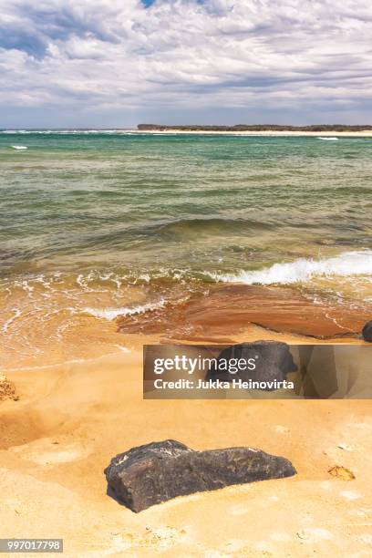 two rocks on a beach - heinovirta stock-fotos und bilder