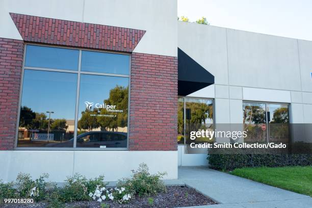 Facade with logo at regional headquarters of laboratory equipment company Caliper Life Sciences on Alameda Island, Alameda, California, July 9, 2018.