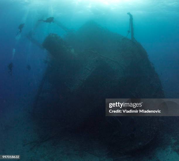scuba diving on the wreck - wreck diving stock pictures, royalty-free photos & images