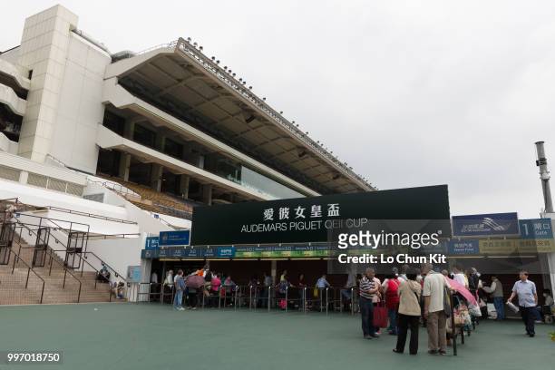 People going to Sha Tin Racecourse during Audemars Piguet Queen Elizabeth II Cup race day on April 26 , 2015 in Hong Kong.