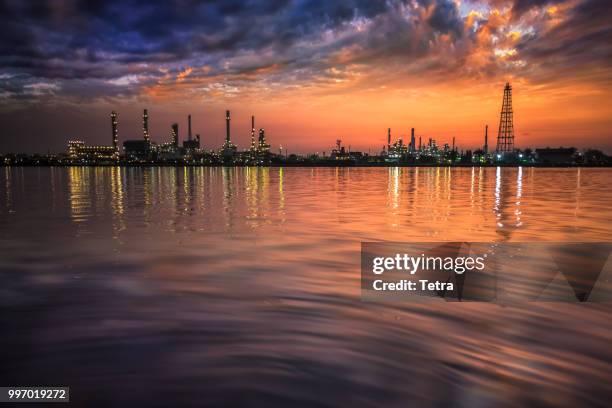 oil and gas industry - refinery at sunrise - factory - petrochem - tetra images stock pictures, royalty-free photos & images