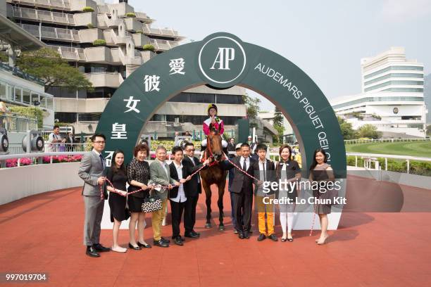 Jockey Tommy Berry , trainer Danny Shum Chap-shing and owners celebrate after Supreme Profit winning Race 5 Audemars Piguet Royal Oak Offshore...