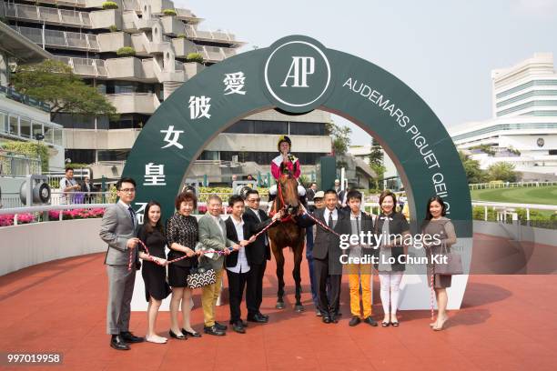 Jockey Tommy Berry , trainer Danny Shum Chap-shing and owners celebrate after Supreme Profit winning Race 5 Audemars Piguet Royal Oak Offshore...