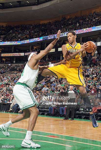 Danny Granger of the Indiana Pacers looks for a play against Paul Pierce of the Boston Celtics on March 12, 2010 at the TD Garden in Boston,...