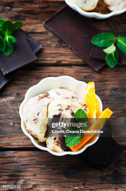 chocolate ice cream with orange and mint - mint ice cream stock pictures, royalty-free photos & images